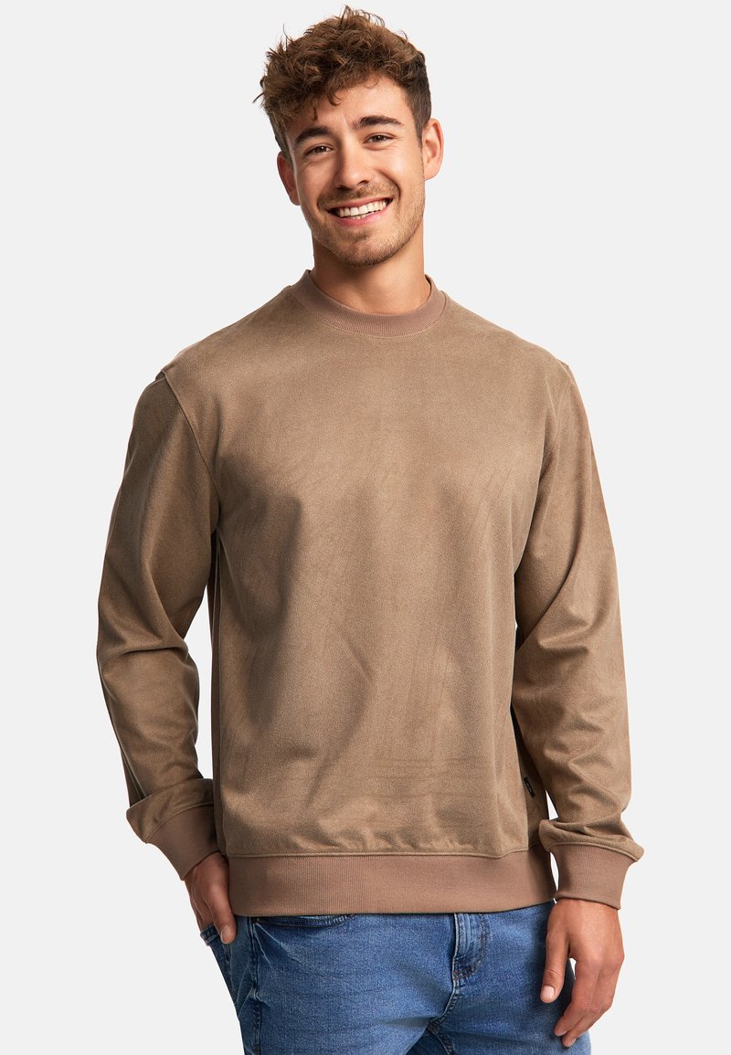 Bruine crewneck sweatshirt met lange mouwen, geribbelde manchetten en tailleband. Soepele textuur met een effen kleur en minimale details.