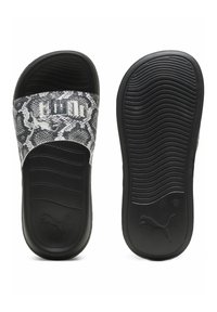 Infradito con motivo serpente in bianco e nero, dotati di una fascia larga con logo, suola texture e un plantare liscio per il comfort.
