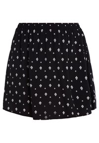 Jupe noire avec une taille élastique, présentant un motif répété de fleurs blanches et de formes géométriques. Tissu doux, coupe évasée, longueur mi-cuisse.