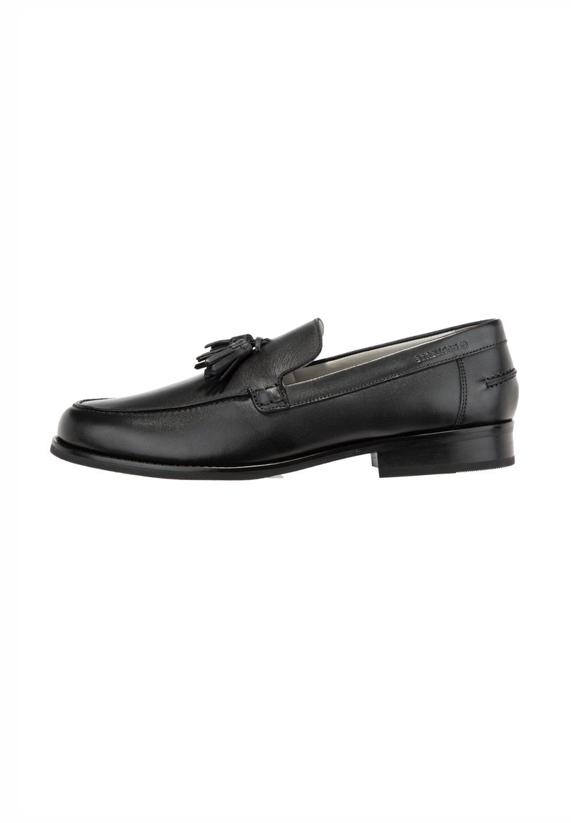 Mocassin homme en cuir noir avec pompons, talon bas et détails cousus, présenté en profil latéral sur fond blanc.