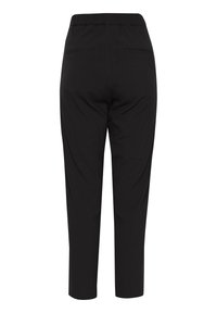 Pantalon noir taille haute fuselé avec taille élastique et deux poches passepoilées à l’arrière, coupe ajustée, longueur cheville.