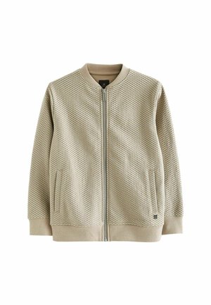Beige Bomberjacke mit Struktur, vorne mit Reißverschluss, gerippten Bündchen und zwei Seitentaschen. Verfügt über einen runden Ausschnitt und ein minimalistisches Design.