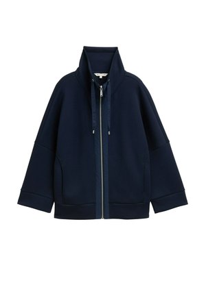 Veste zippée bleu marine avec col haut, cordons de serrage, manches longues et poches latérales, présentée sur fond blanc.