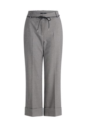 Pantalons à carreaux noir et blanc, dotés d'une taille à cordon de serrage, de jambes larges et de poignets repliés. Fabriqués en tissu léger.