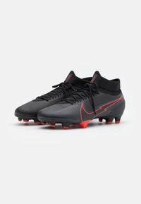 Nike Performance Jalkapallokengät kiinteälle alustalle - black
