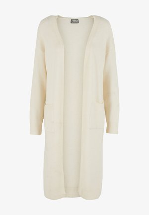 Langer Cardigan mit offenem Vorderteil aus weichem, cremefarbenem Stoff. Verfügt über zwei Fronttaschen und gerippte Bündchen. Einfaches, minimalistisches Design.