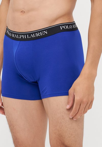 Boxeri bleu dintr-un material neted, cu un design ajustat, având un brâu negru cu branding alb "POLO RALPH LAUREN".