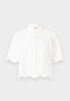 White short-sleeve shirt with a collared neckline, featuring intricate cut-out designs and scalloped hem. Button-front closure.