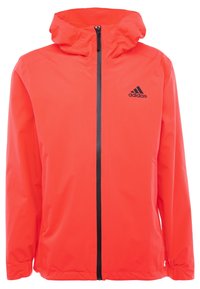 Red lightweight jacket with a hood, front zip closure, and black logo. Smooth texture and elastic cuffs for a fitted look.