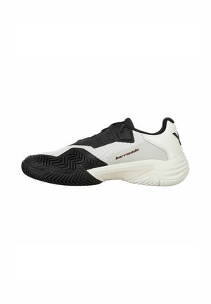 Tennisschoenen met een slank ontwerp. Beschikt over een zwart-witte mesh bovenkant, een gestructureerde rubberen zool en een verstevigde hiel voor stabiliteit.