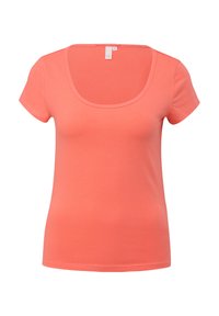 Koraalkleurig T-shirt met korte mouwen en een ronde hals. Gemaakt van een zachte katoenmix met een gladde textuur.