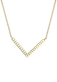 Collana in tono oro con pendente a forma di V, decorato con accenti a pois e una finitura liscia, attaccato a una delicata catenina.