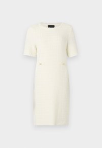 Robe blanche à manches courtes, texturée, avec un motif à carreaux, comportant deux petites accents dorés à la taille. Encolure ronde.