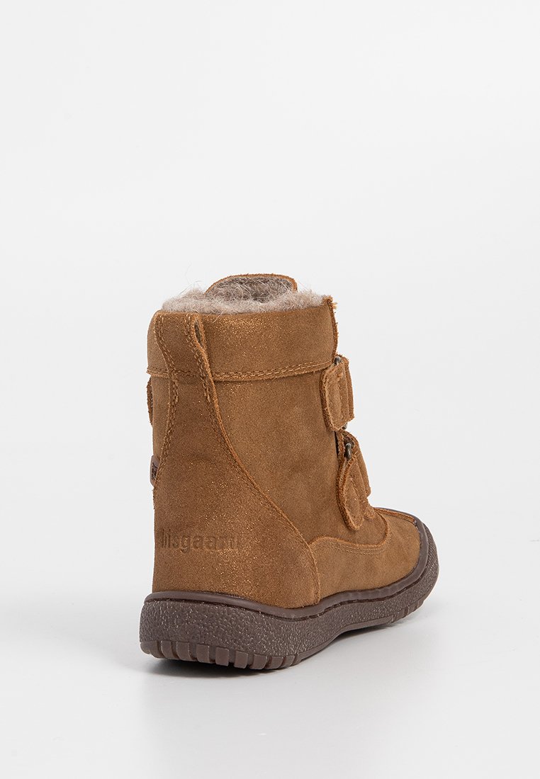 Braun Wildlederstiefel mit einem hohen Knadesign, verstellbaren Klettverschlüssen, einem Kunstfellfutter und einer strukturierten Gummisohle für besseren Halt.