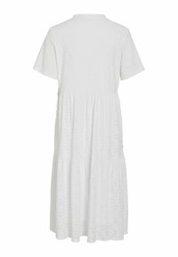 Robe en coton blanche avec des manches courtes, texture à œillets à pois, col rond et design à jupe plissée.