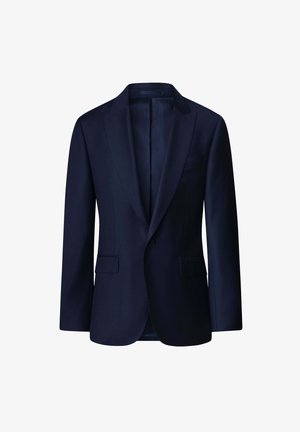 Laivansinis takki, jossa on teräväkaulukset, kaksi etutaskua ja yhden napin kiinnitys. Mukautettu malli, jossa on sileä pinta ja vuorattu sisustus.