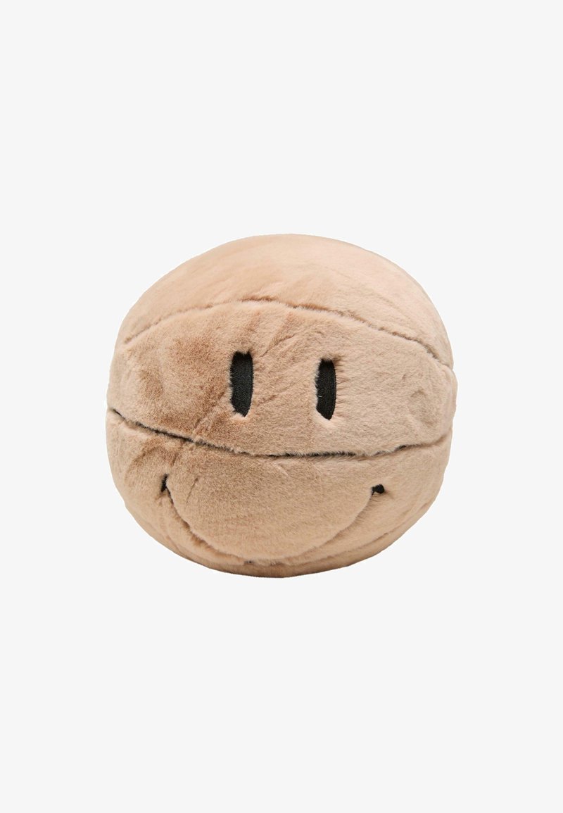 Almohada redonda de felpa en color beige con un diseño de cara sonriente, que presenta ojos y boca negros, textura suave y costuras bordadas.