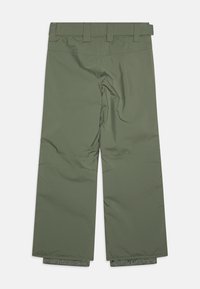 Gröna isolerade byxor med rak passform, justerbart midjeband och elastiska muddar vid anklarna; slät textur med sömmar.