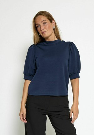 Navy blue puff-sleeve top with a high neckline, made of soft fabric. The design features gathered shoulders and a relaxed fit.