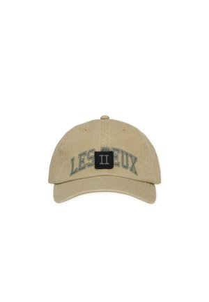 Beige baseball cap with "LES DEUX" text and black square patch featuring a white Roman numeral II on the front panel.