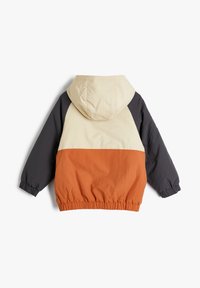 Hooded jacket met een color-block ontwerp in beige, donkergrijs en gebrande sinaasappel. Elastische manchetten en tailleband, lichte stoftextuur.
