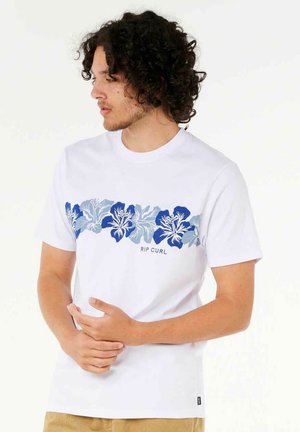 White cotton t-shirt with blue floral graphic and "RIP CURL" text across the chest. Short sleeves and round neckline, relaxed fit.