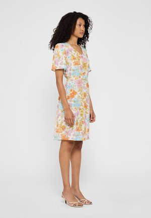 Bloemendress met korte poffende mouwen in lichte pastelkleuren, met een V-hals en een getailleerde taille. Gemaakt van lichtgewicht, gestructureerde stof.
