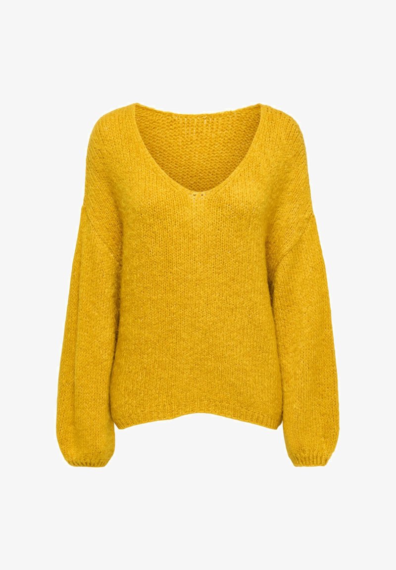 Gelber Strickpullover mit V-Ausschnitt, überschnittenen Schulternähten und langen Ärmeln. Die Textur ist weich und grob gestrickt.