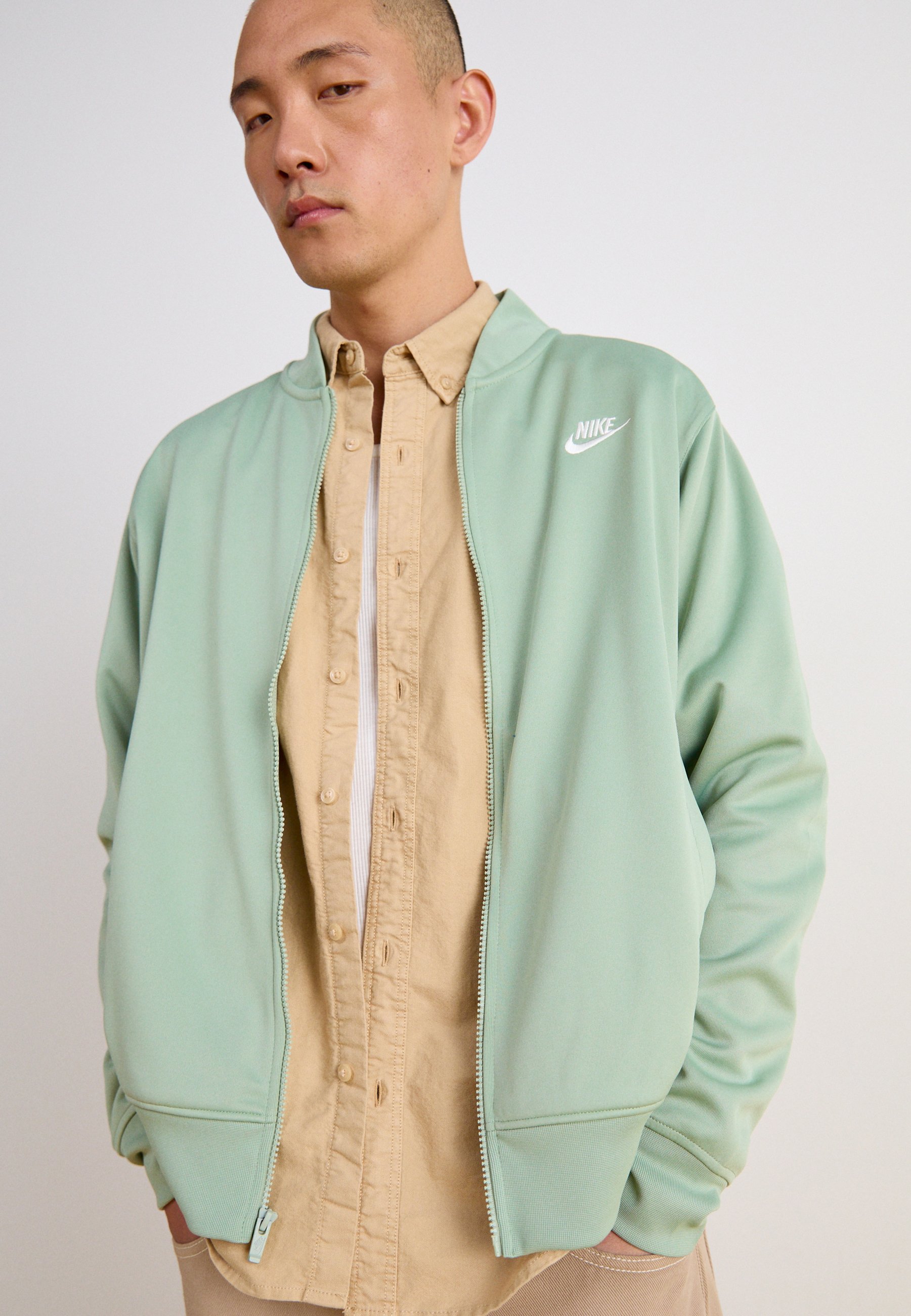 nike club fleece bomber track top