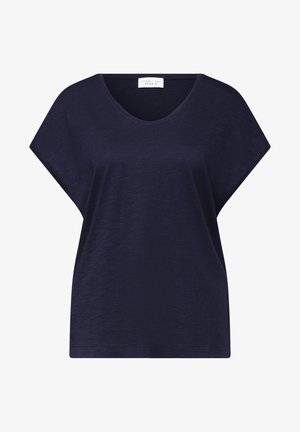 Top blu navy a maniche corte, vestibilità ampia con scollatura a V e texture minimale, etichetta "Street One Studio" all'interno del colletto.