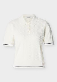 Άσπρο πλεκτό πόλο με κοντά μανίκια και υφή, τρία κουμπιά, ναυτικό μπλε φινίρισμα στα μανίκια και στο τελείωμα, και μικρό λογότυπο Calvin Klein Jeans.