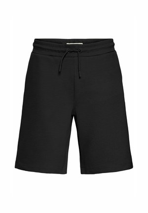 Crne atletske šortsice od materijala s teksturom i valovitom šablonom. Imaju elastičan pojas s vezicom za prilagodljivu veličinu.