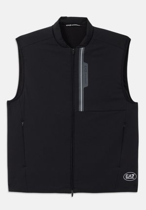 Gilet nero senza maniche realizzato in tessuto leggero, con zip frontale, due tasche laterali e un accento riflettente con logo.