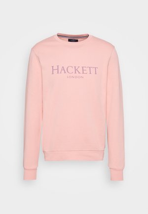 Felpa rosa chiaro con maniche lunghe, scollo a girocollo e polsini a coste. Sul davanti è presente il logo "HACKETT" in viola scuro e la scritta "LONDON" sotto.