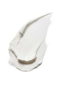 White creamy texture, thick and smooth, softly spread with a curved edge, set against a plain white background.