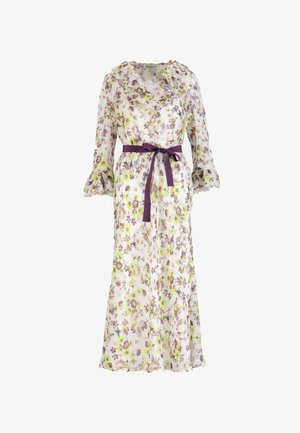 Long white floral dress with yellow and purple flowers, ruffled collar and sleeves, and a tied purple waist belt.