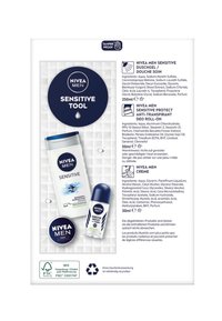 NIVEA Men Produktverpackung mit einem weißen Hintergrund und drei Artikeln: einer grauen Shampooflasche, einem blauen Roll-On und einer schwarzen Cremedose.