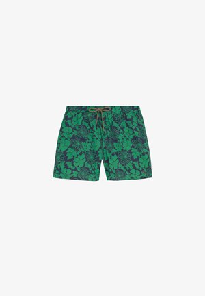 Bañador de hombre con estampado floral verde sobre fondo oscuro y cintura con cordón marrón.