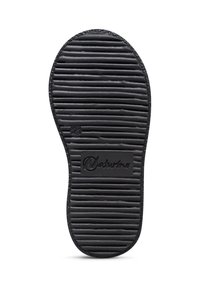 Semelle de chaussure noire avec des rainures horizontales, taille numéro 21, et le nom de la marque "Naturino" embossé au centre.