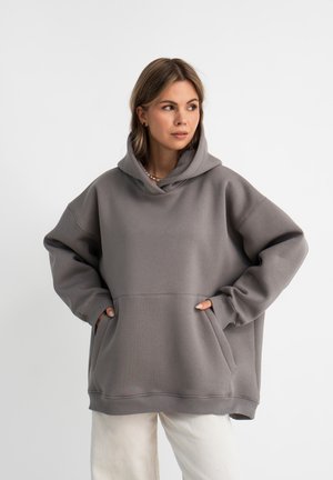 Oversized grijze hoodie van zacht materiaal, met een trekkoordcapuchon, grote voorzakken en ribgebreide manchetten en zoom.
