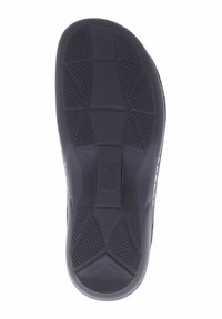 Black rubber shoe sole featuring textured grip pattern, rectangular shapes, and raised accents for traction. Size indicated as 38.