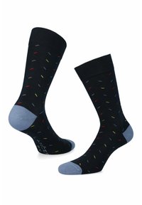 Granatowe skarpetki w wielokolorowe kropki, z prążkowanym ściągaczem oraz jasnoniebieskimi akcentami na palcach i piętach. Wykonane z mieszanki bawełny.