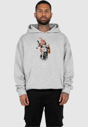 Gray hoodie featuring a printed design of Lady Justice holding scales and a sword, with orange flames in the background. Adjustable drawstring hood.