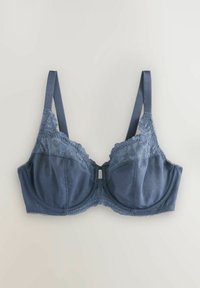 Donkerblauwe beha van gladde stof, met kantaccenten langs de bovenkant en de bandjes, voorzien van beugels en verstelbare schouderbandjes.