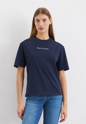 Navy blue cotton t-shirt with short sleeves. Features a round neck and "Marc O’Polo" logo printed in white on the front.