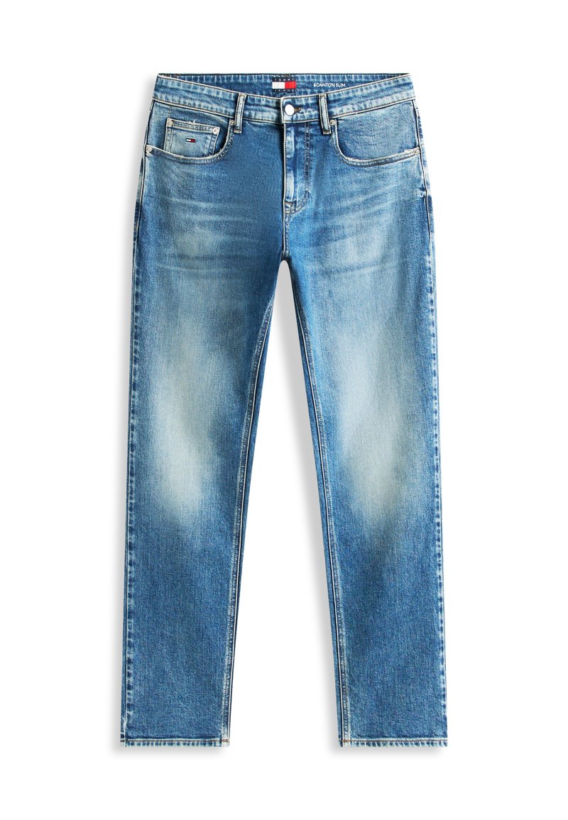 Jean denim bleu coupe ajustée avec détails délavés, cinq poches, passants pour ceinture, et fermeture avant par bouton et fermeture éclair.