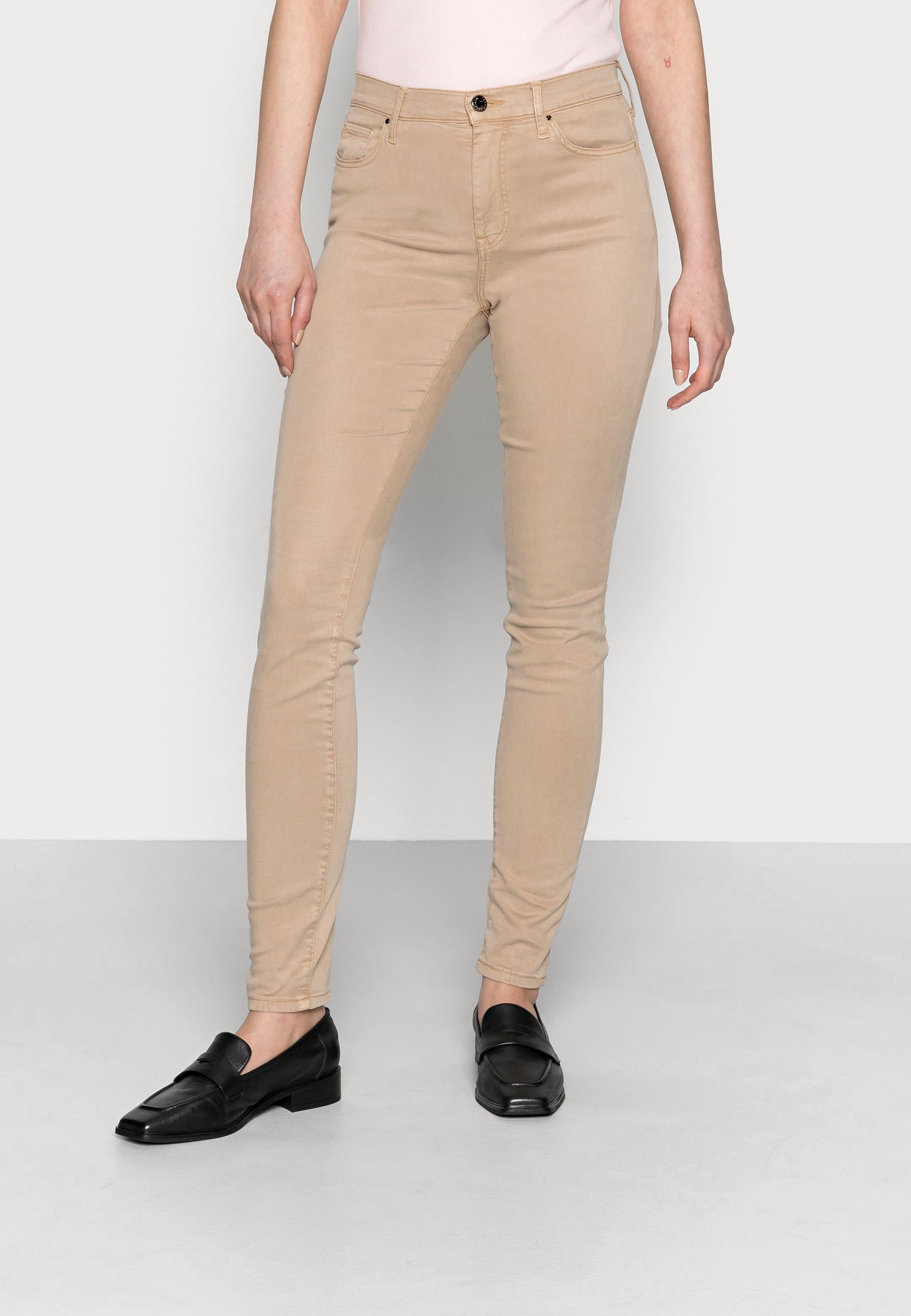 Pantalon beige tommy hilfiger Outlet