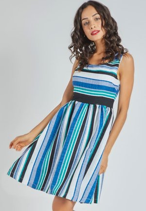 Vestido a rayas con colores azul, negro y blanco, con un corsé ajustado, falda acampanada y tirantes ajustables.
