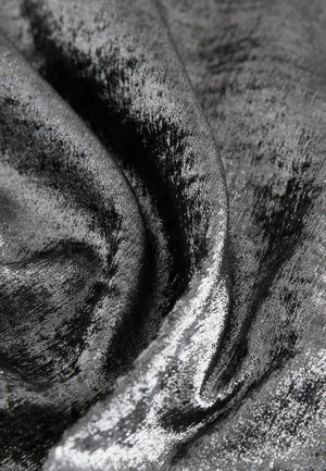 Black velvet fabric with a soft, smooth texture, featuring subtle sheen and slight variations in color across the surface.