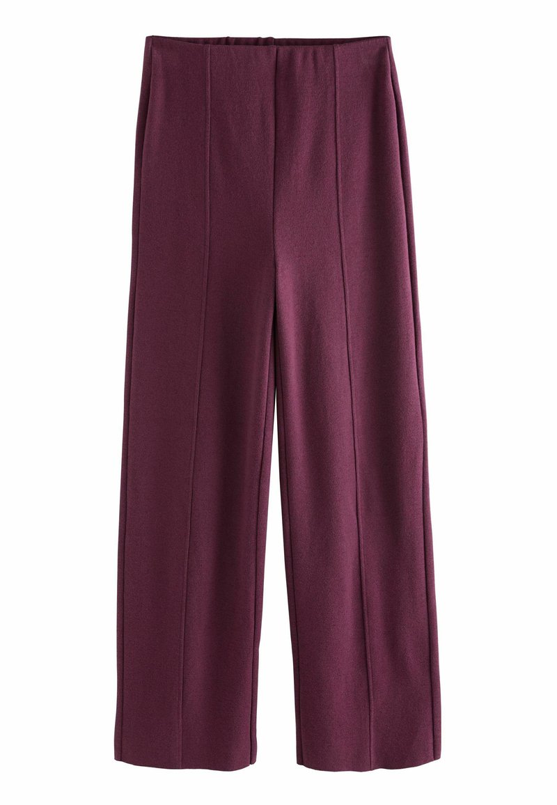 Pantalons larges en tissu texturé bordeaux, dotés d'une taille haute et de coutures verticales pour un look ajusté.